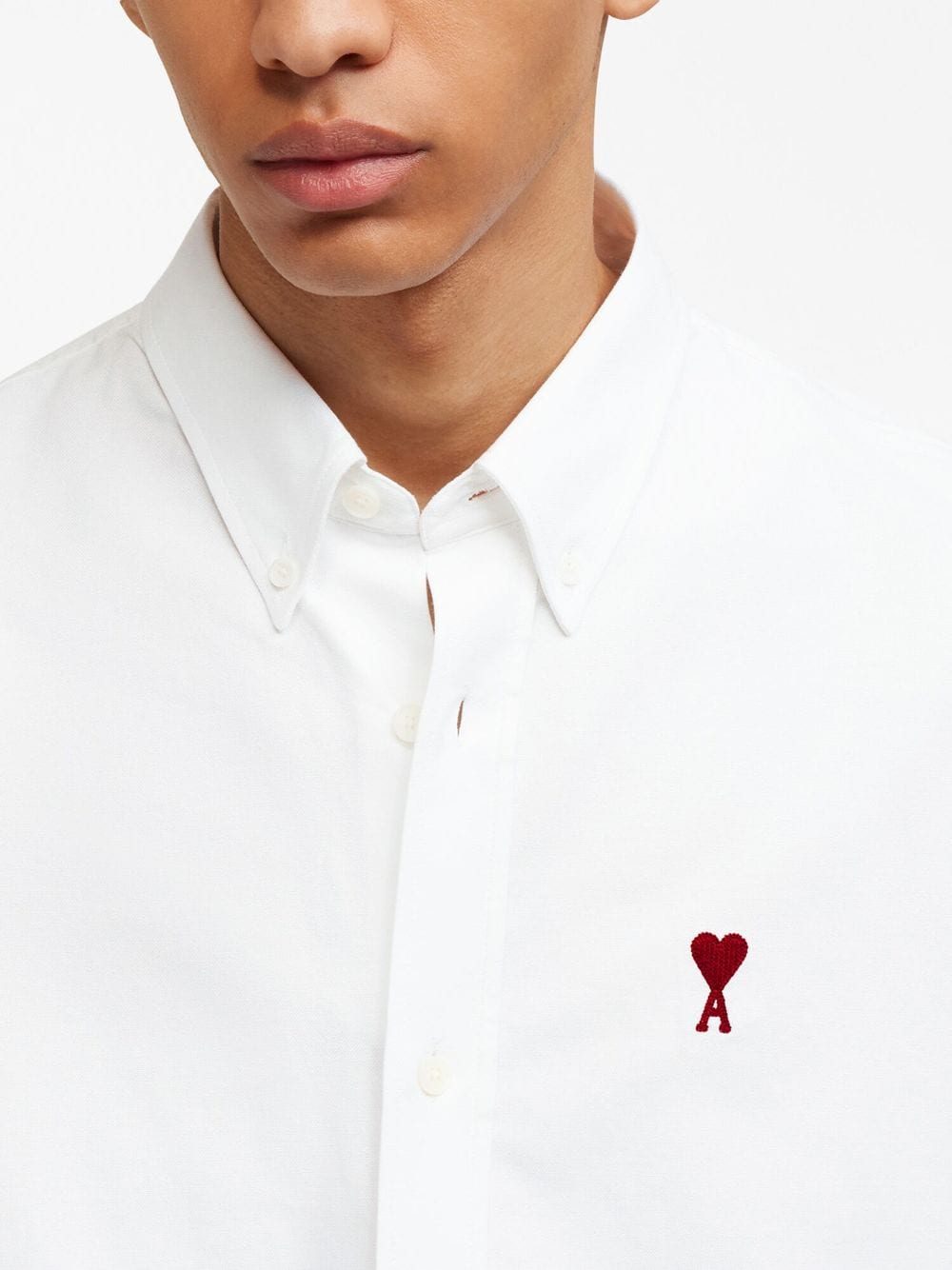 CAMISA BLANCA LOGO ROJO