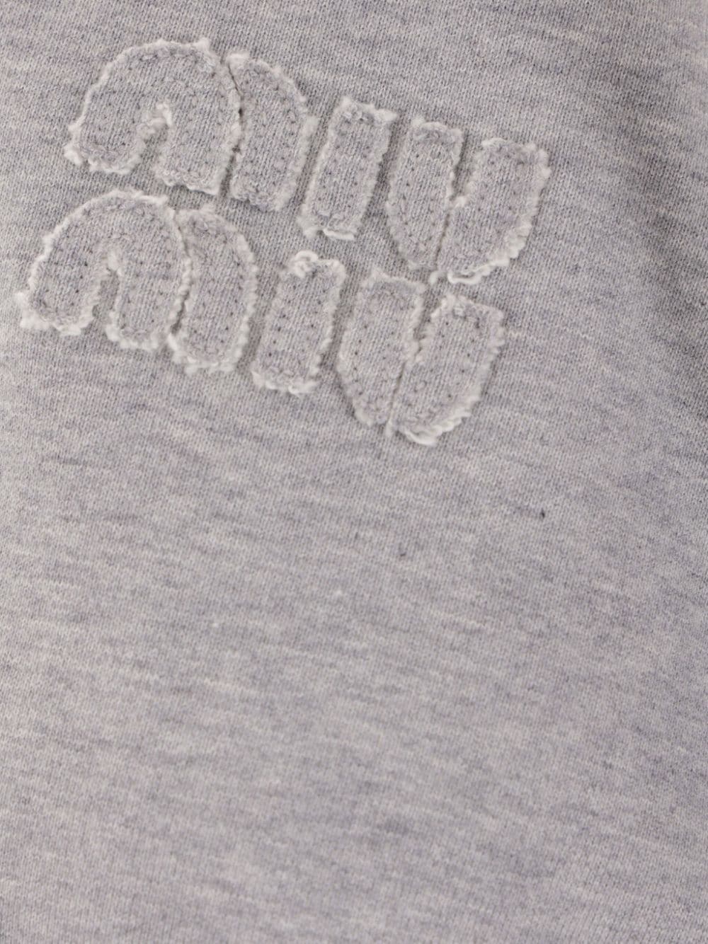 HOODIE GRIS LOGO GRIS CORDONES MARRONES