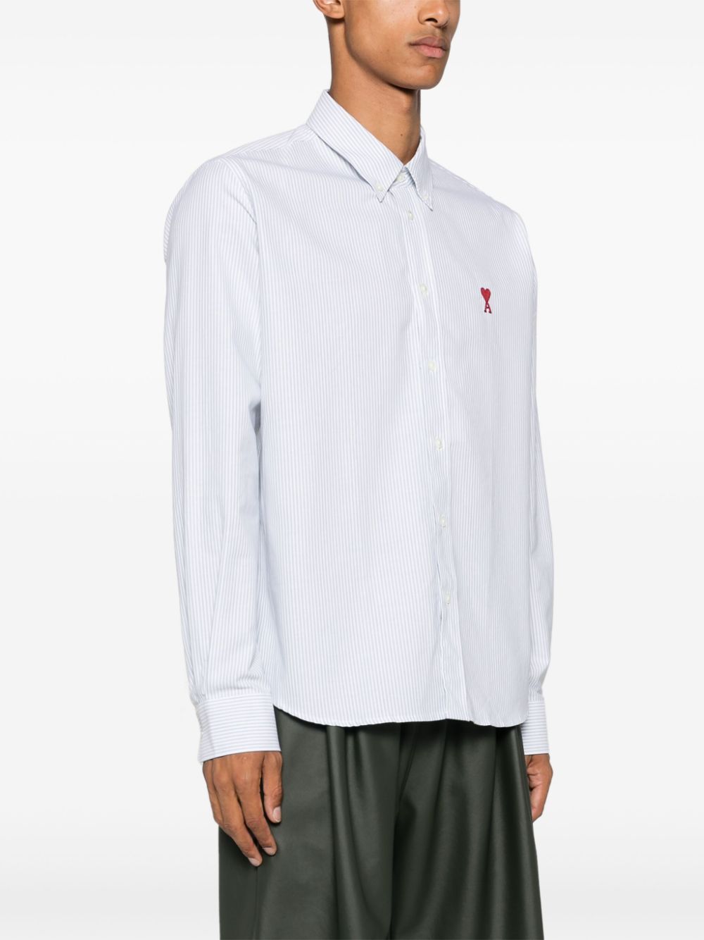 CAMISA BLANCA VERDE RAYAS LOGO ROJO